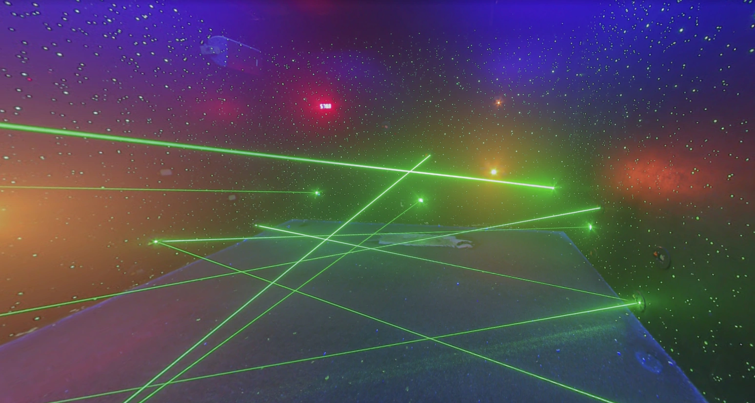 Neon-glowing laser maze platform with space-themed lighting